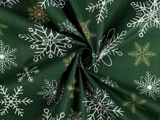 Attēls ar 100% Kokvilnas audums - sniegpārslas uz zaļa fona 125 g/m – pieejams Šarlotes audumi