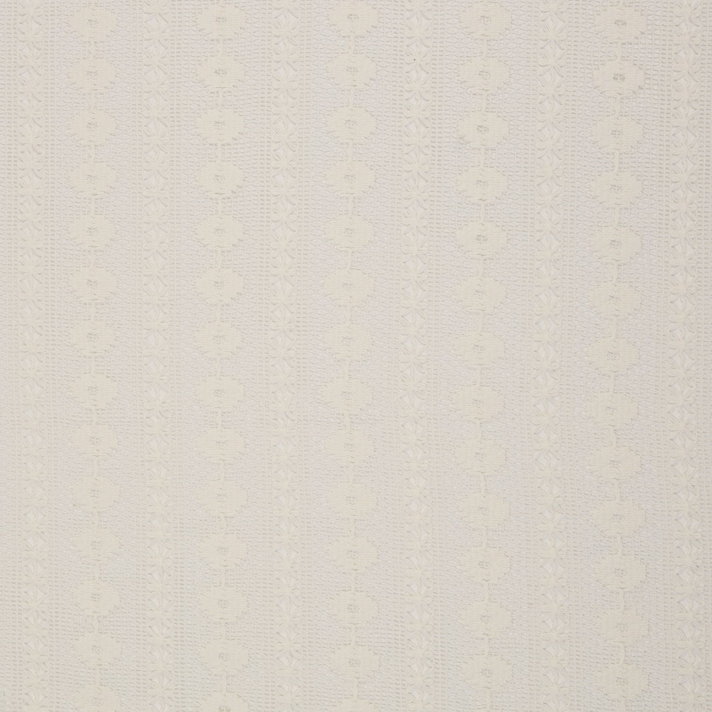 Image of lace fabric, warm white with a floral pattern – available online at Charlotte's Fabrics