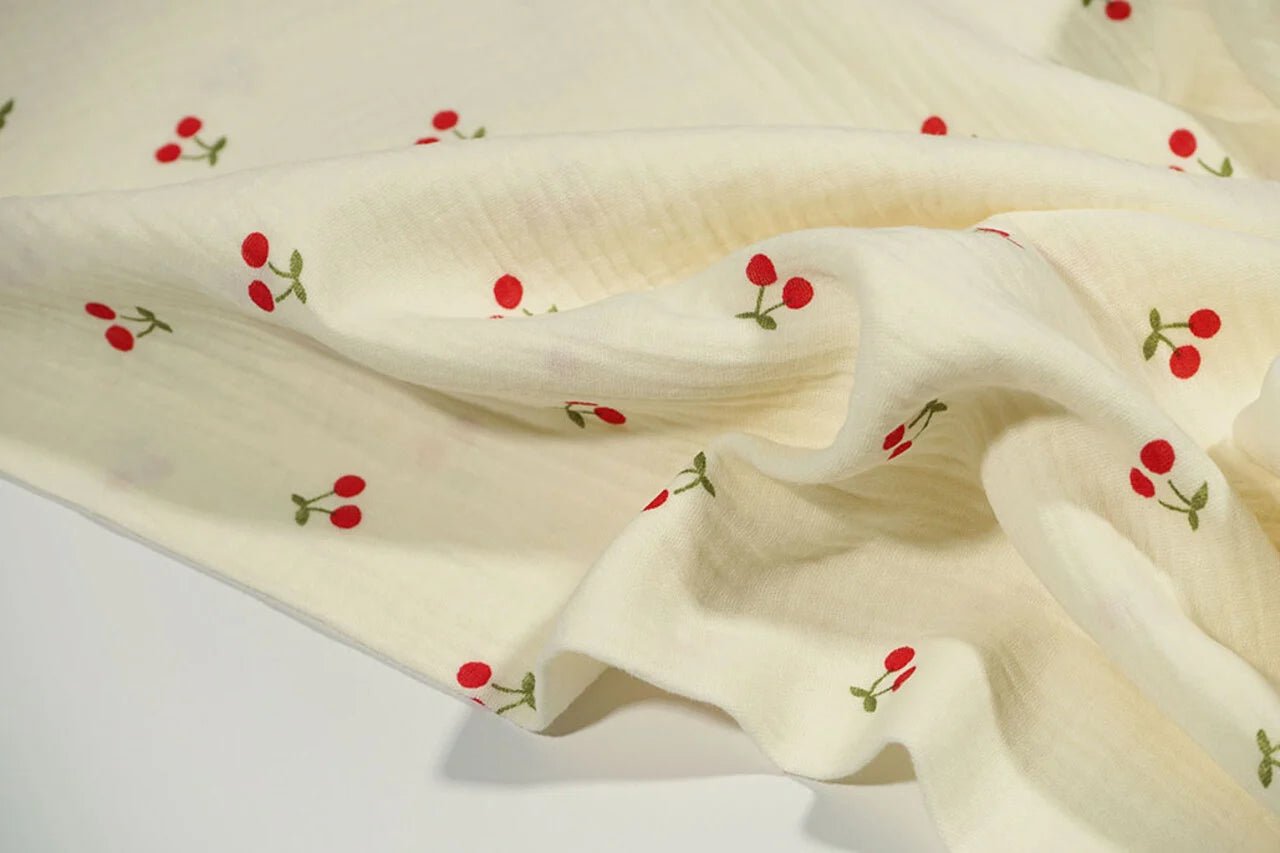 Muslīns - ķirši uz sviesta dzeltena fona 125 g/m²