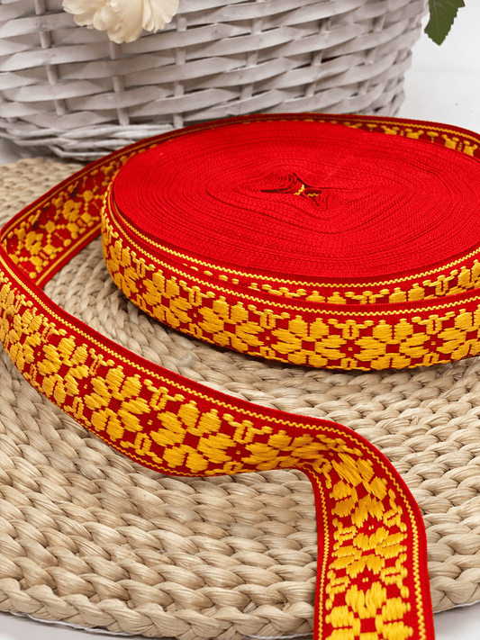 Image of a folk ribbon, 36mm belt, red with yellow LV – available online at Šarlotes audumi