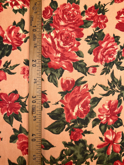 Polyamide crepe fabric with red floral pattern on a beige background – Italy
