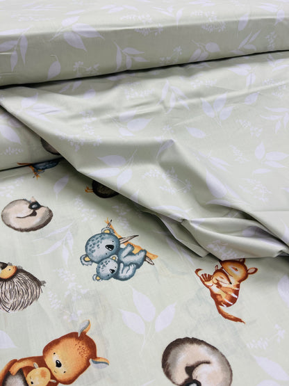 100 % coton - motif de feuilles sur fond vert tendre 125 g/m²