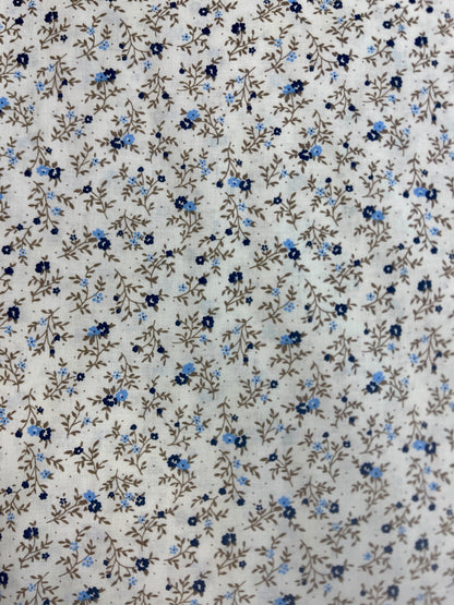 Image of 100% cotton fabric with tiny, delicate flowers – available online at Charlotte's Fabrics