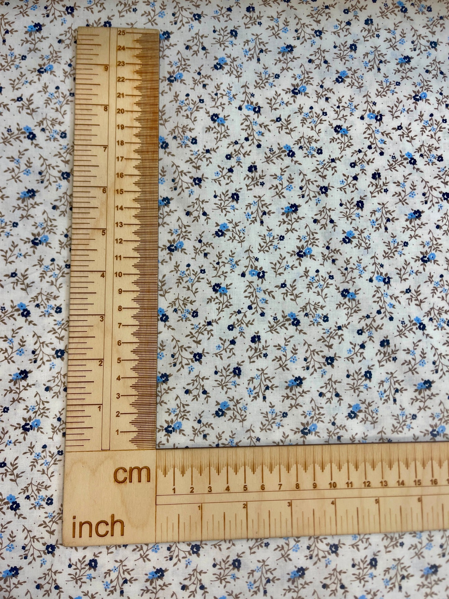 Image of 100% cotton fabric with tiny, delicate flowers – available online at Charlotte's Fabrics