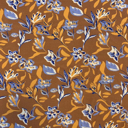 Tissu 100 % viscose - motif floral abstrait sur fond orange 125 g/m²