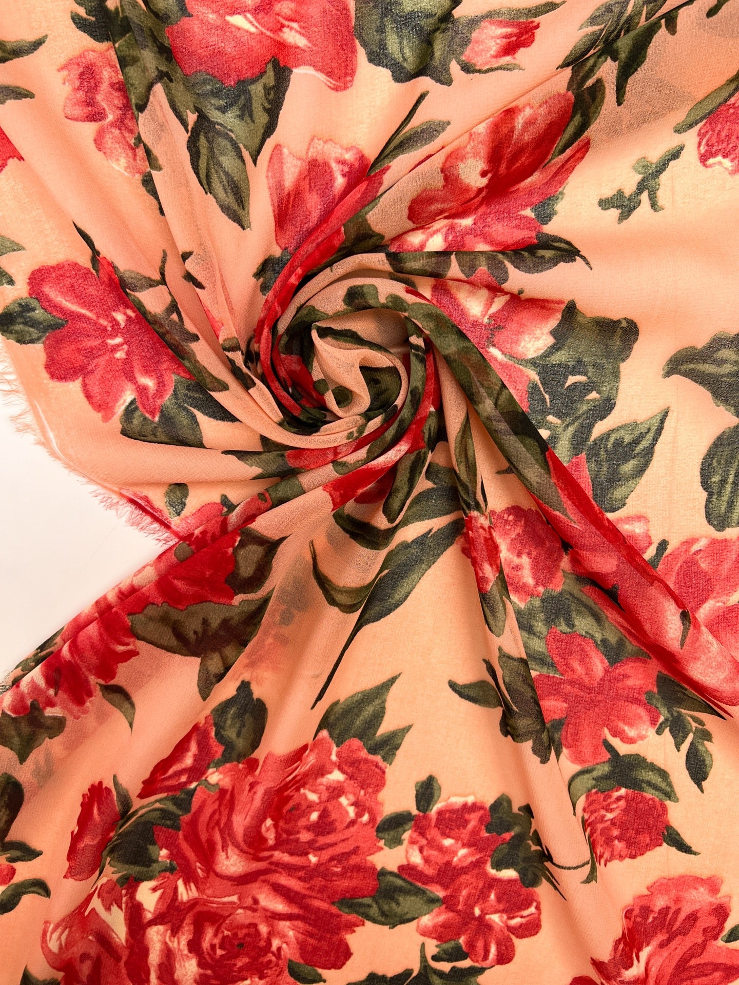 Polyamide crepe fabric with red floral pattern on a beige background – Italy