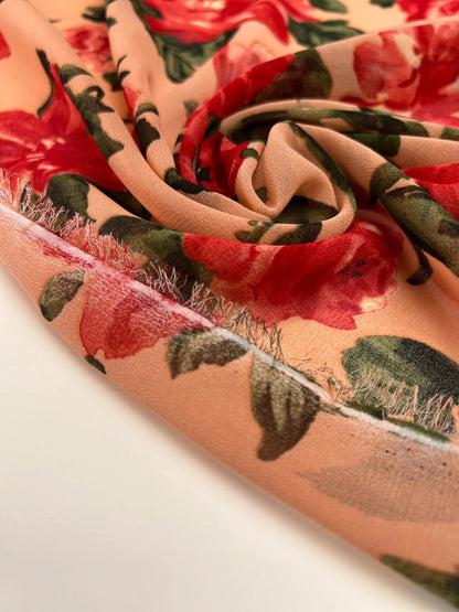 Polyamide crepe fabric with red floral pattern on a beige background – Italy