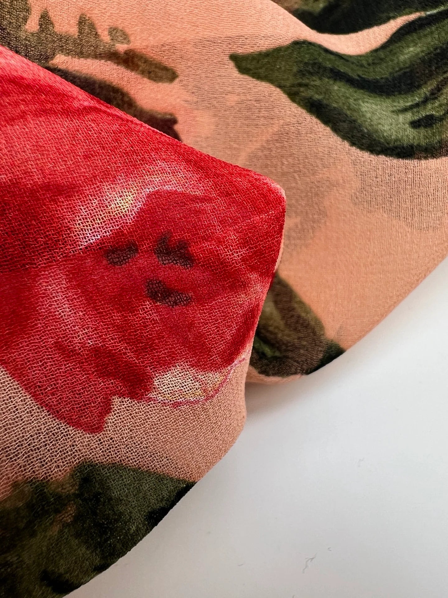 Polyamide crepe fabric with red floral pattern on a beige background – Italy