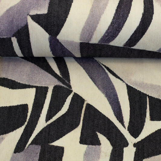 Image of denim fabric with abstract pattern—black, gray and white, 190 g/m² – available at Šarlotes audumi