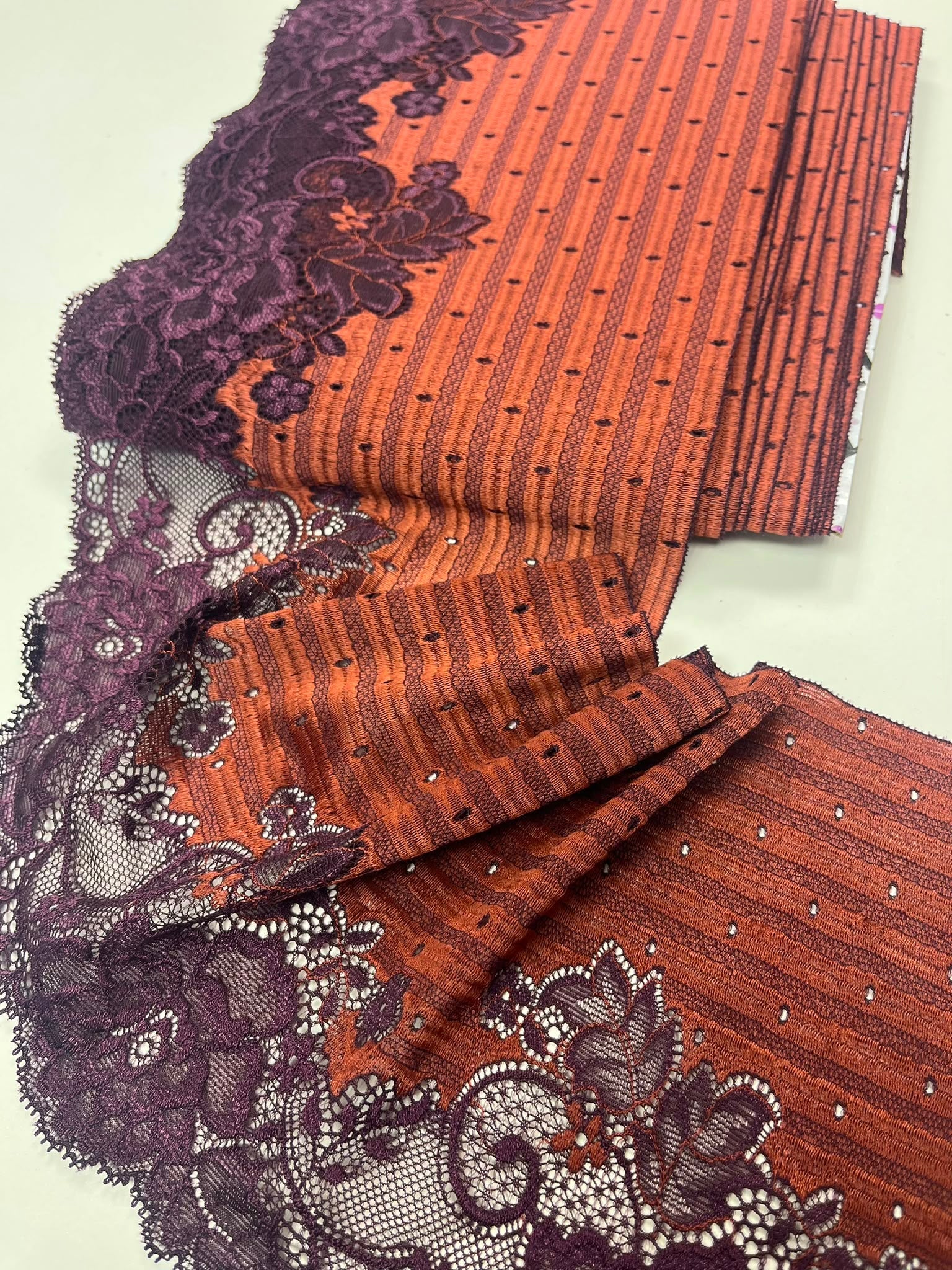 Image of elastic floral lace, 18 cm, orange with lilac – available online at Šarlotes audumi