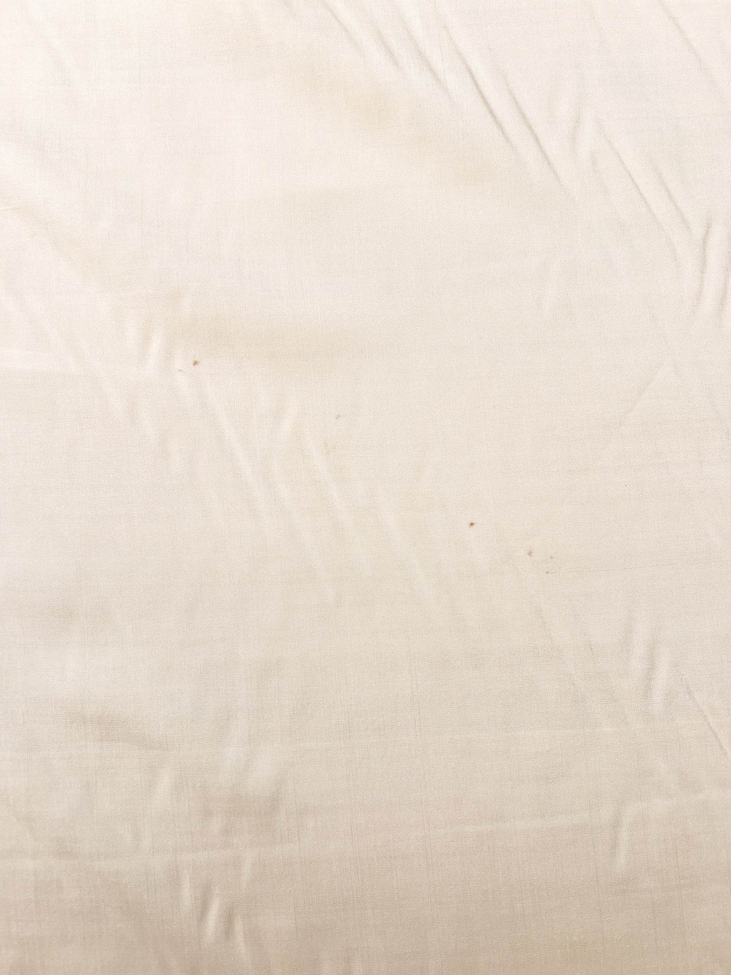 Image of Italian 100% silk fabric in a creamy white shade – available online at Charlotte's Fabrics