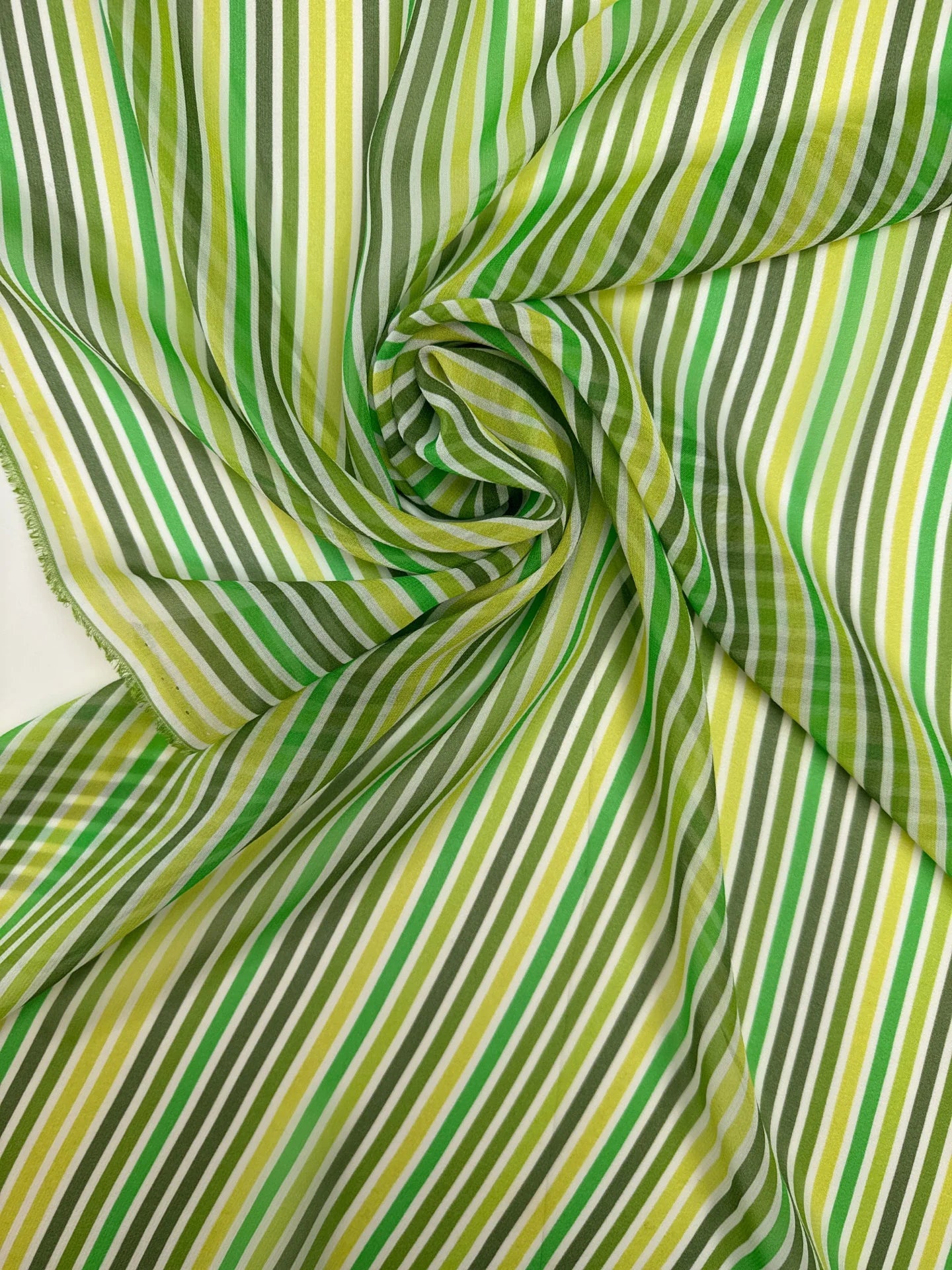 Image of Italian 100% silk crepe fabric with green stripes, available online at Charlotte's Fabrics