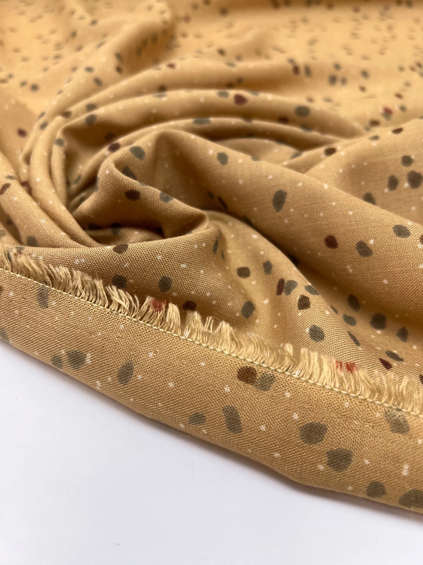 Image of Italian acrylic fabric with a beige and brown polka dot pattern – available online at Šarlotes audumi