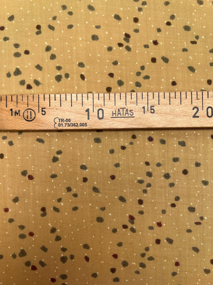 Image of Italian acrylic fabric with a beige and brown dot pattern – available online at Charlotte's Fabrics