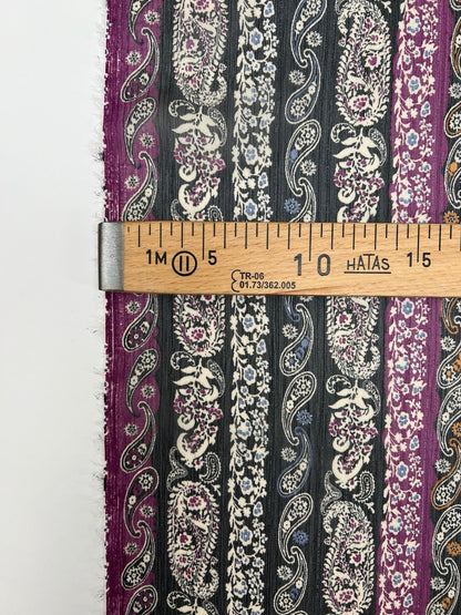 Image of Italian chiffon fabric with a black and purple paisley pattern and lurex thread – available online at Charlotte's Fabrics