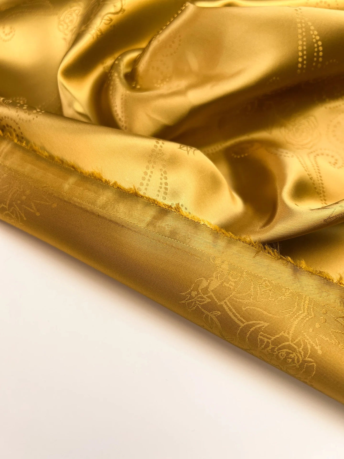 Image of Italian viscose jacquard fabric in a golden tone – available online at Šarlotes audumi