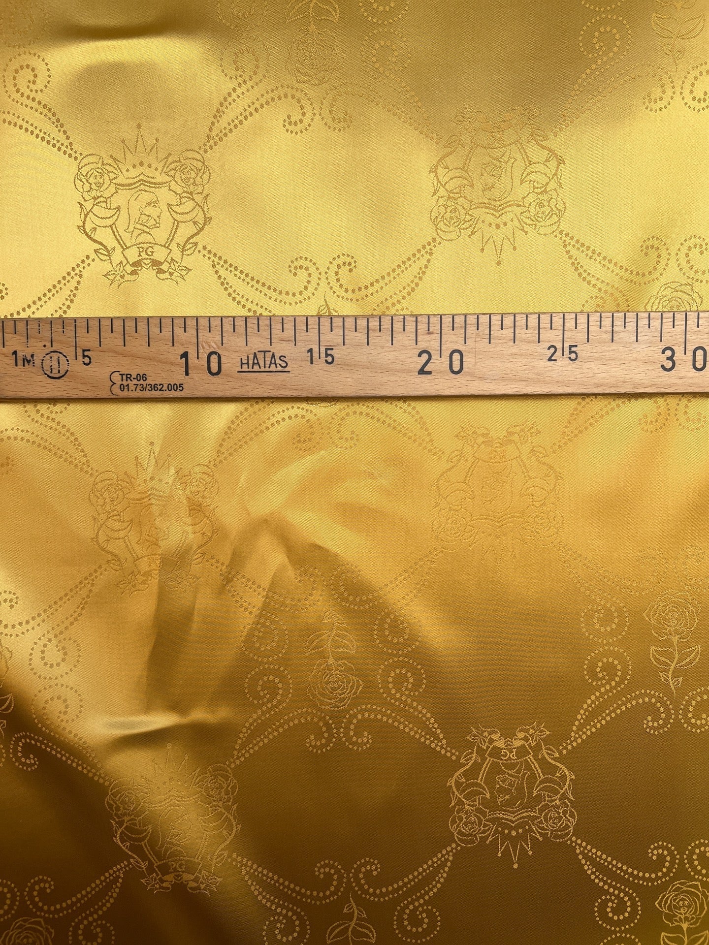 Image of Italian viscose jacquard fabric in a golden tone, available online at Charlotte’s Fabrics
