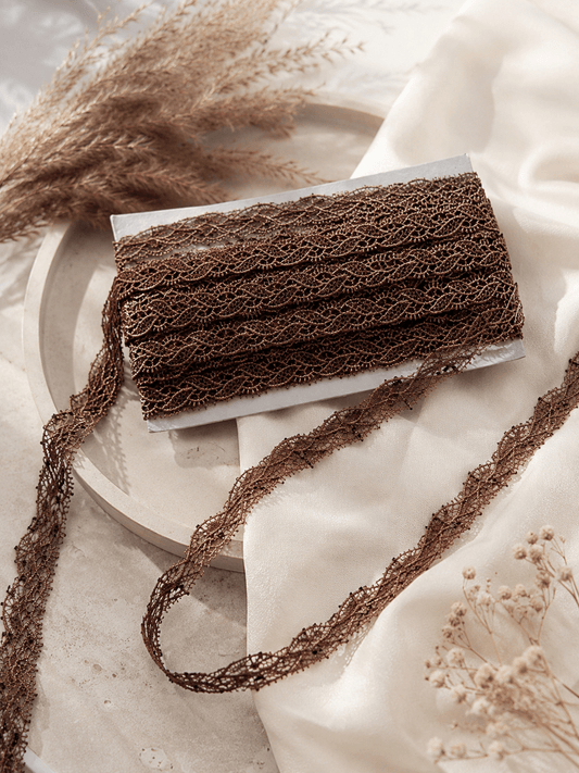 Image with embroidered lace ribbon 1.5 cm - brown with black accents – available at Charlotte's Fabrics