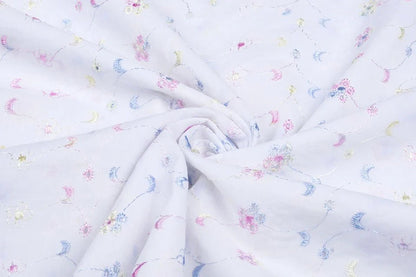 Tissu en coton brodé - broderie multicolore 110 g/m²