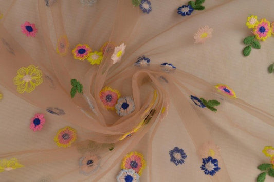Image of embroidered tulle fabric with flowers - peach shade 70 g/m² – available at Šarlotes audumi