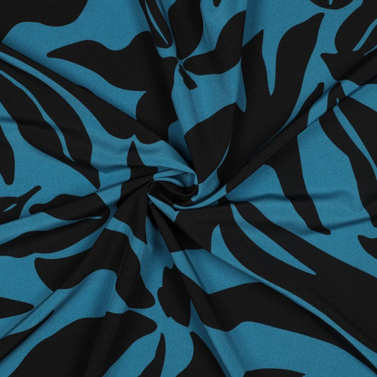 Attēls ar Kleitu audums ar elastānu - raibs raksts uz petrol fona 80 g/m² – pieejams Šarlotes audumi