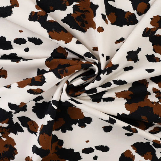 Attēls ar Kokvilnas cilpiņtrikotāža ar siltinājumu - govs raksts 230 g/m² – pieejams Šarlotes audumi