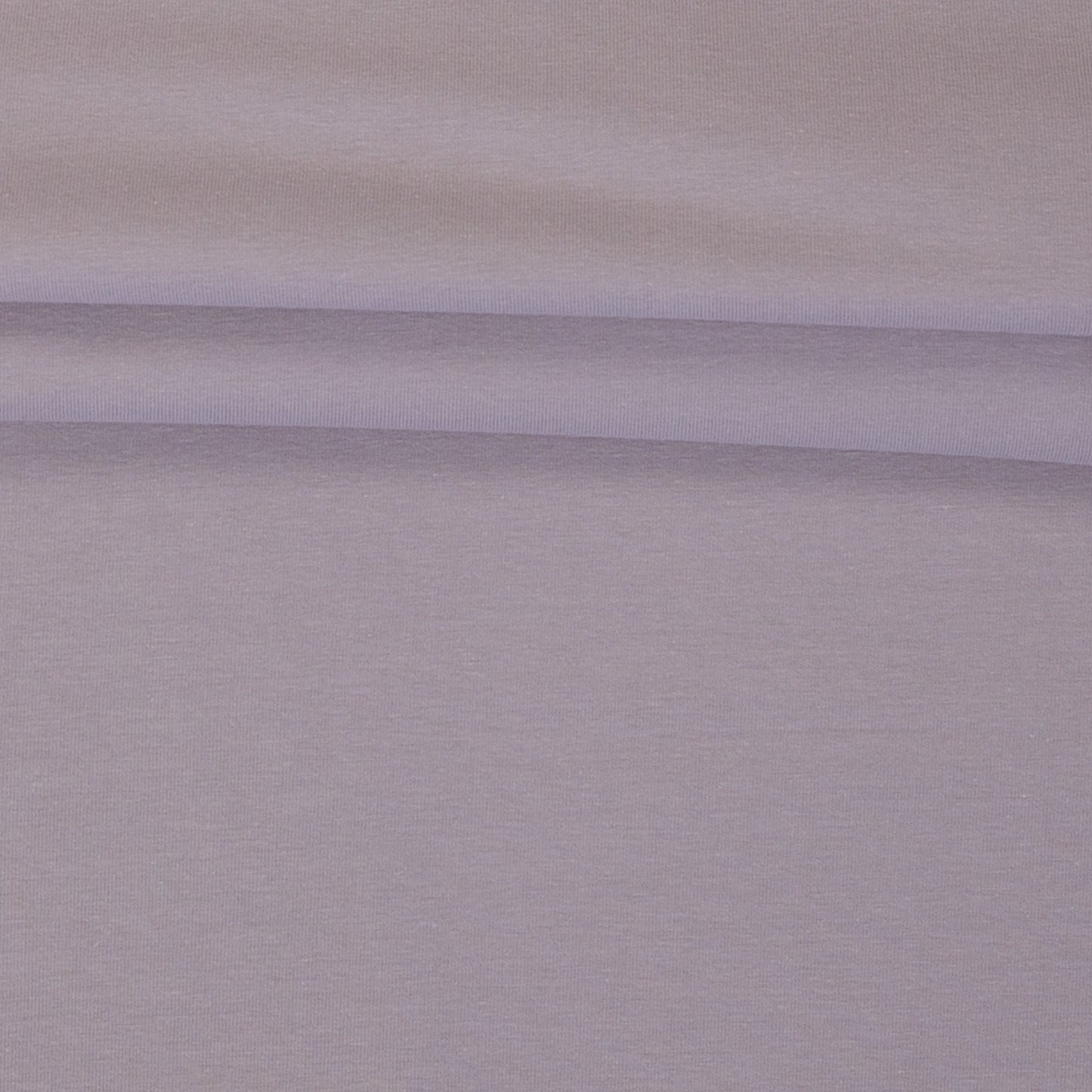 Image with cotton loopback jersey fabric in smoky lilac pink – available online at Šarlotes audumi