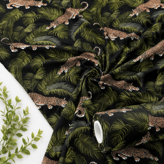 Image of cotton knit fabric - leaves and leopards 220 g/m² – available at Šarlotes audumi