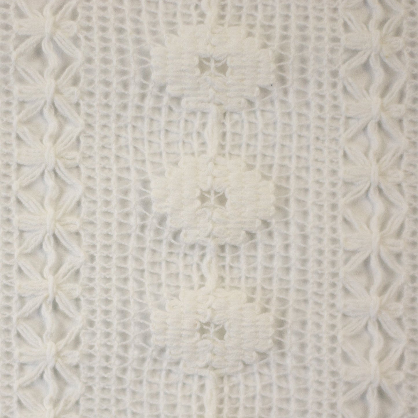 Image of lace fabric, warm white with a floral pattern – available online at Charlotte's Fabrics
