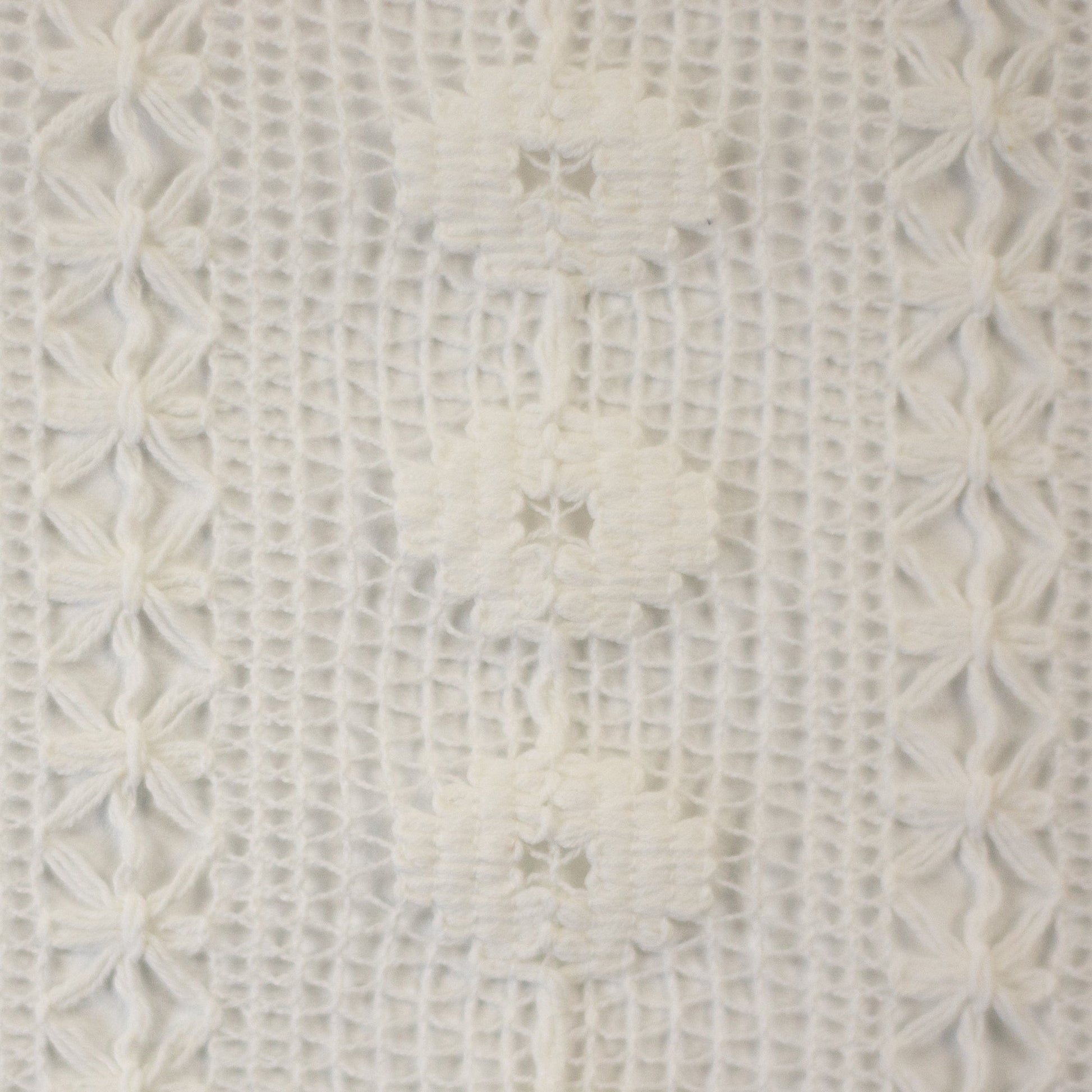 Image of lace fabric, warm white with a floral pattern – available online at Charlotte's Fabrics