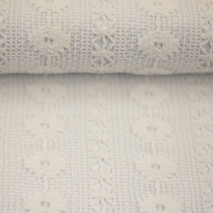 Image of lace fabric, warm white with a floral pattern – available online at Charlotte's Fabrics