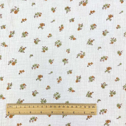 alt
Mousseline - fleurs sur fond orange 130 g/m²