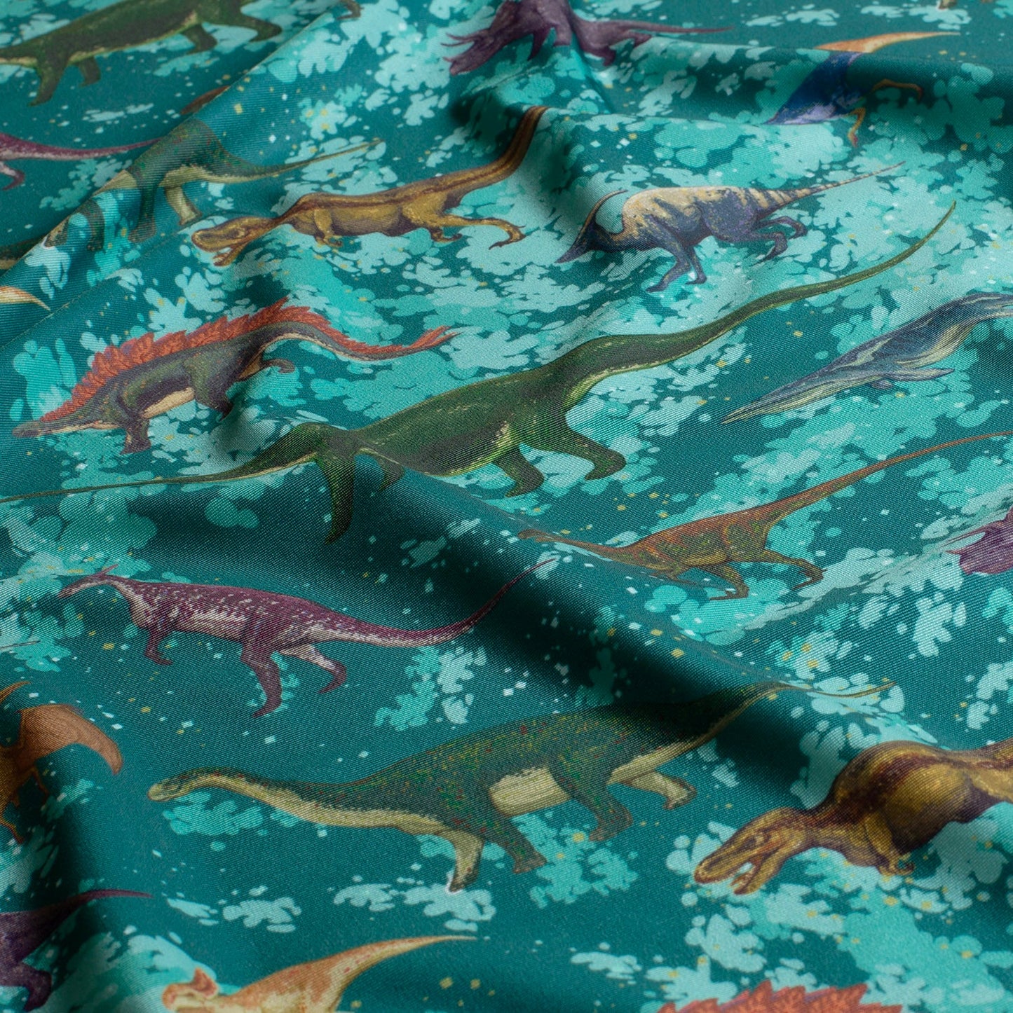 Image avec tissu de maillot de bain en lycra avec protection UPF50 – dino 200 g/m² – disponible chez Šarlotes audumi