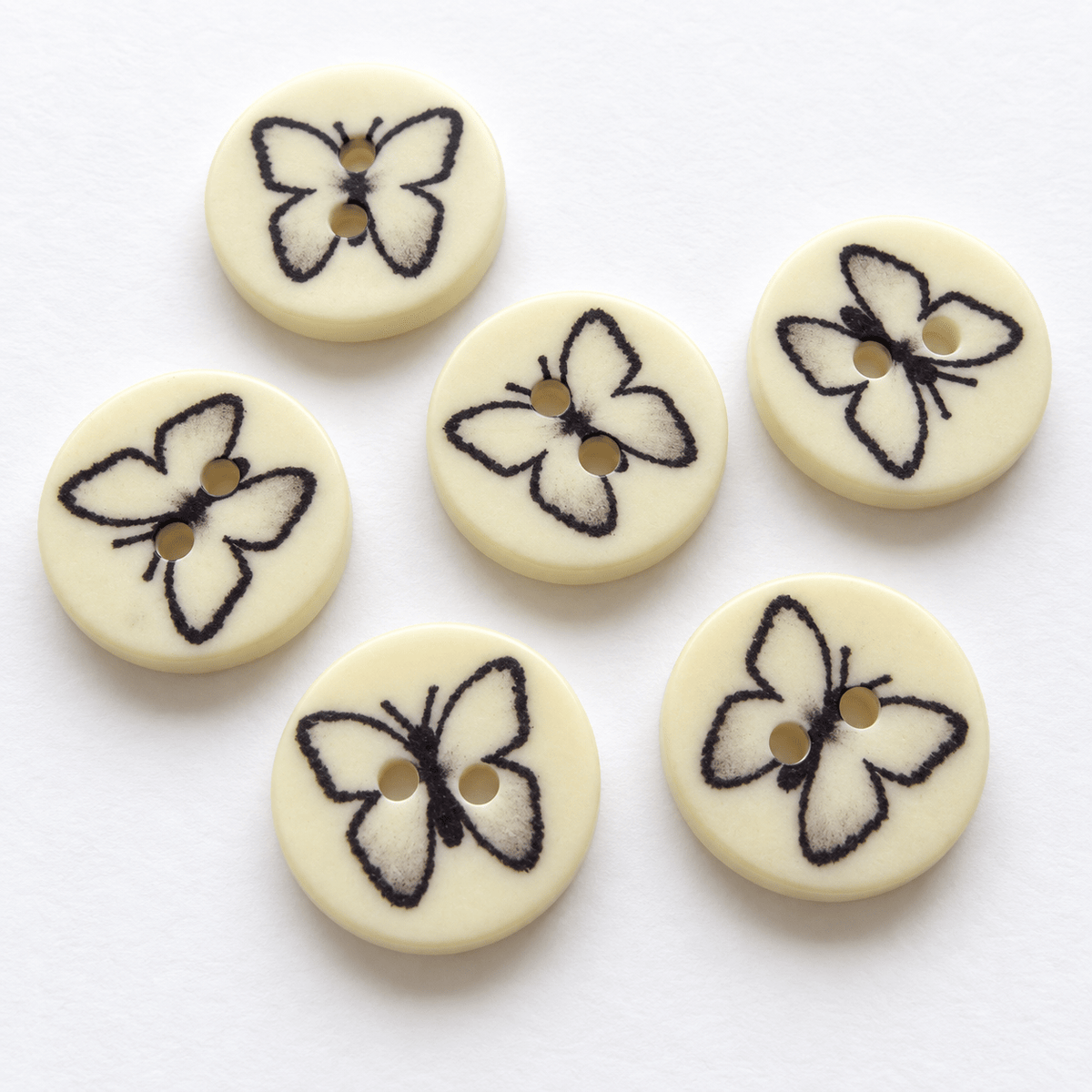 Image of plastic butterfly buttons 14 mm – available online at Charlotte's Fabrics