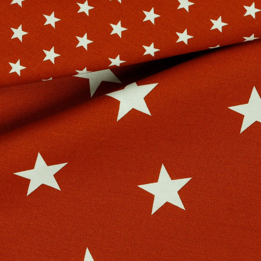 Attēls ar Premium 100% cotton fabric-stars on a terracotta background 130 g/m² – available at Šarlotes audumi