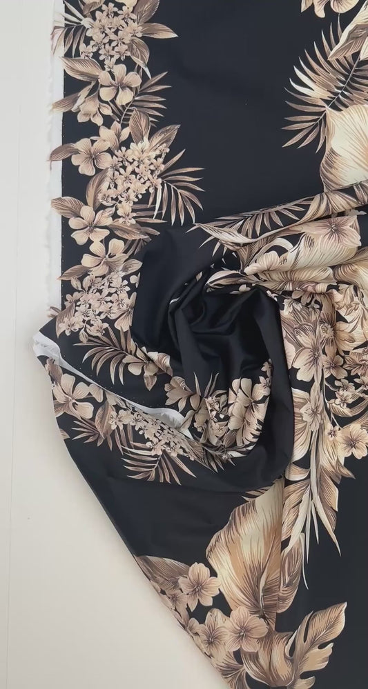 Italian cotton fabric with tropical floral pattern on a black background – 120 g/m²