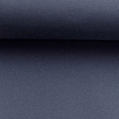 Image du tissu softshell - bleu jean fumé 300 g/m² – disponible chez Šarlotes audumi