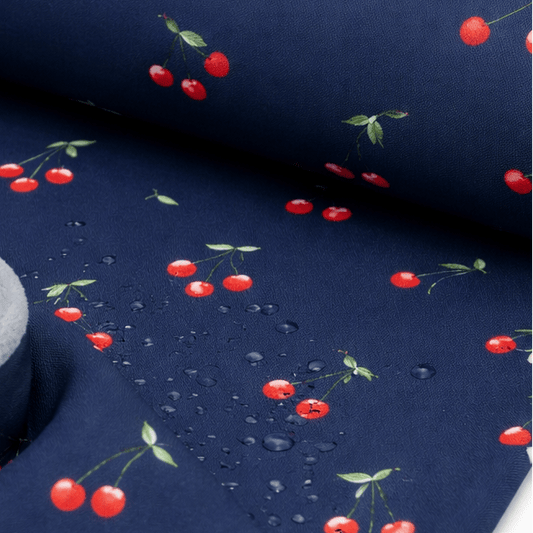 Attēls ar Softshell audums - ķirši uz tumši zila 300 g/m² – pieejams Šarlotes audumi