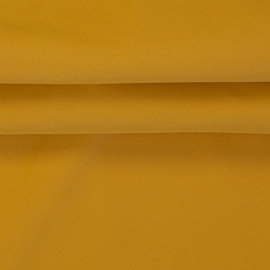 Image of waterproof softshell fabric – mustard shade, available online at Charlotte's Fabrics