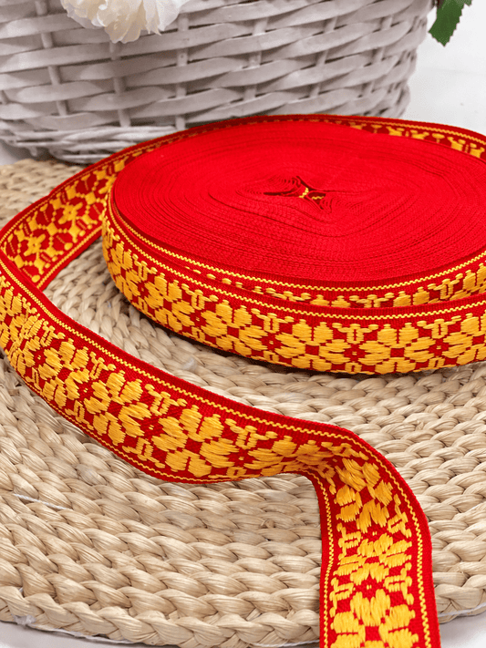 Image of a traditional ribbon, 36 mm red belt with yellow LV – available online at Šarlotes audumi