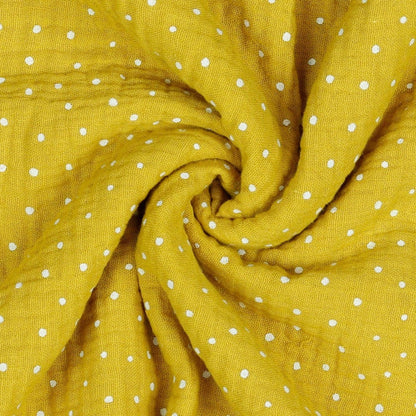 Mousseline à pois sur fond jaune miel 130 g/m²