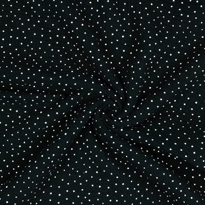 Mousseline à pois sur fond noir 125 g/m²
