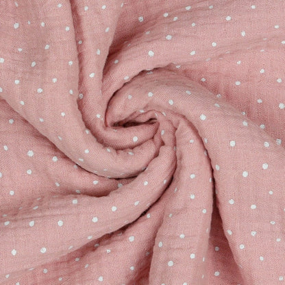 Musselin mit Pünktchen auf rosa Hintergrund 125 g/m²